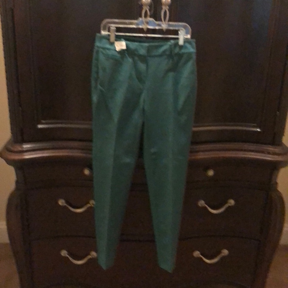 Teal slim ankle pants look like new.